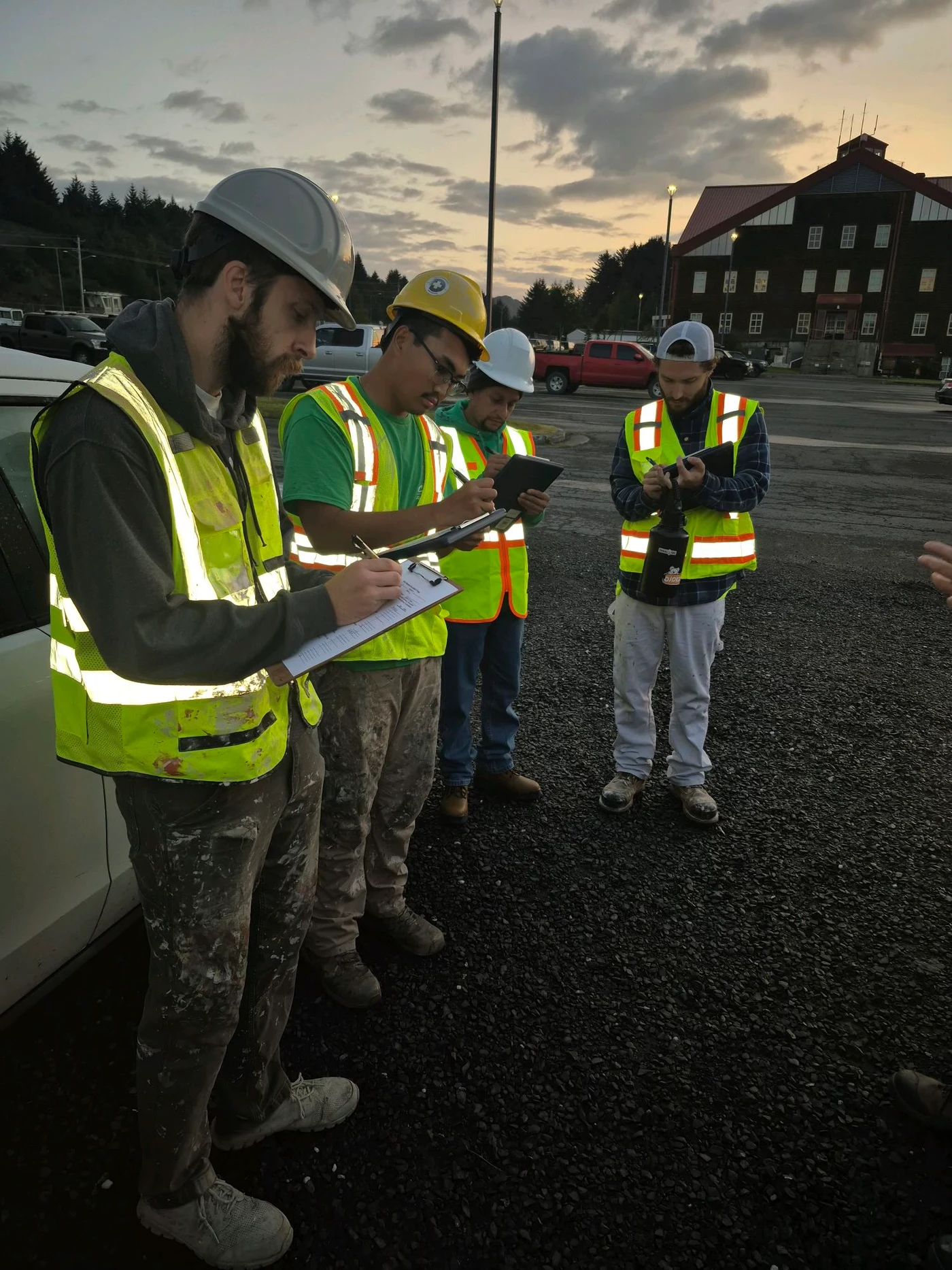 Campbell Painting crew conducting morning JHA safety sign-in at USCG Base Kodiak