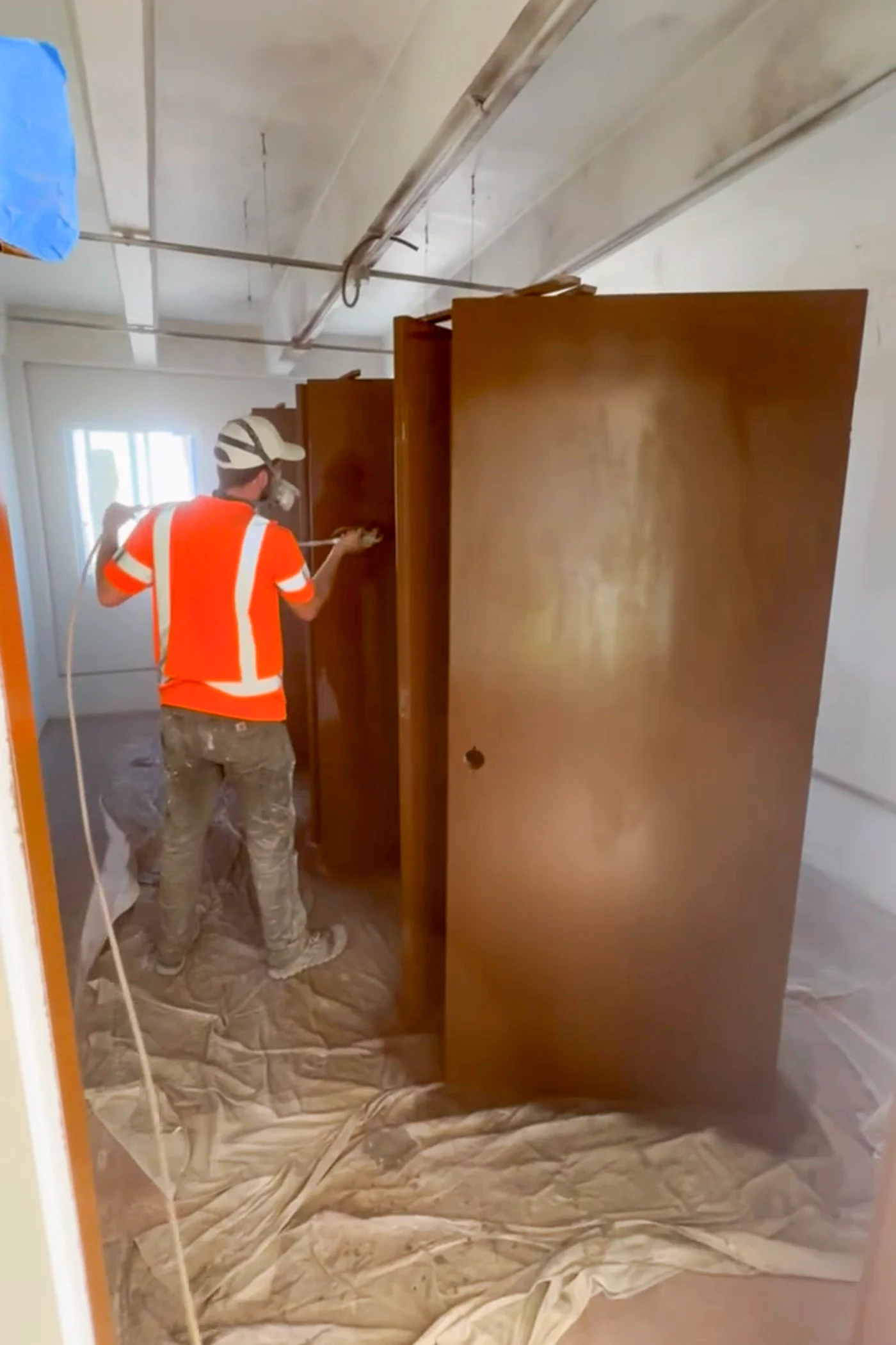 Airless spray coating architectural doors on Wake Island
